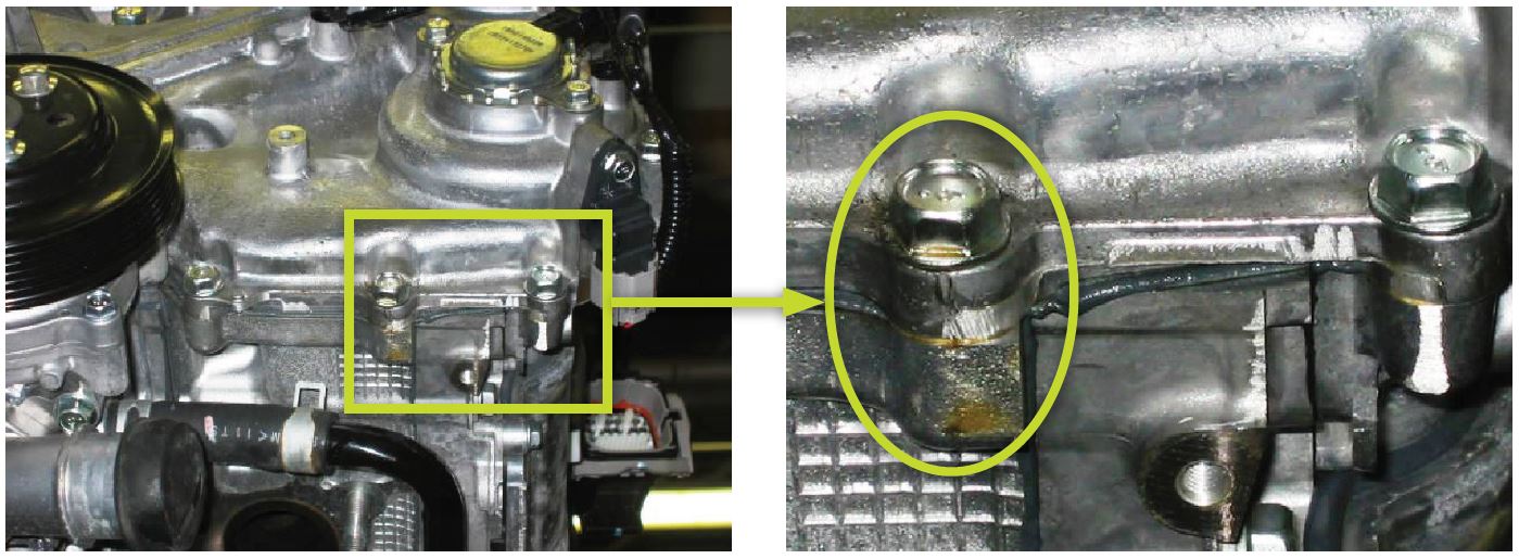 reseal the front chain cover AFTER confirming there is no oil seepage coming from the either cam retainer cap (area 1) and / or the cam carrier (area 2)