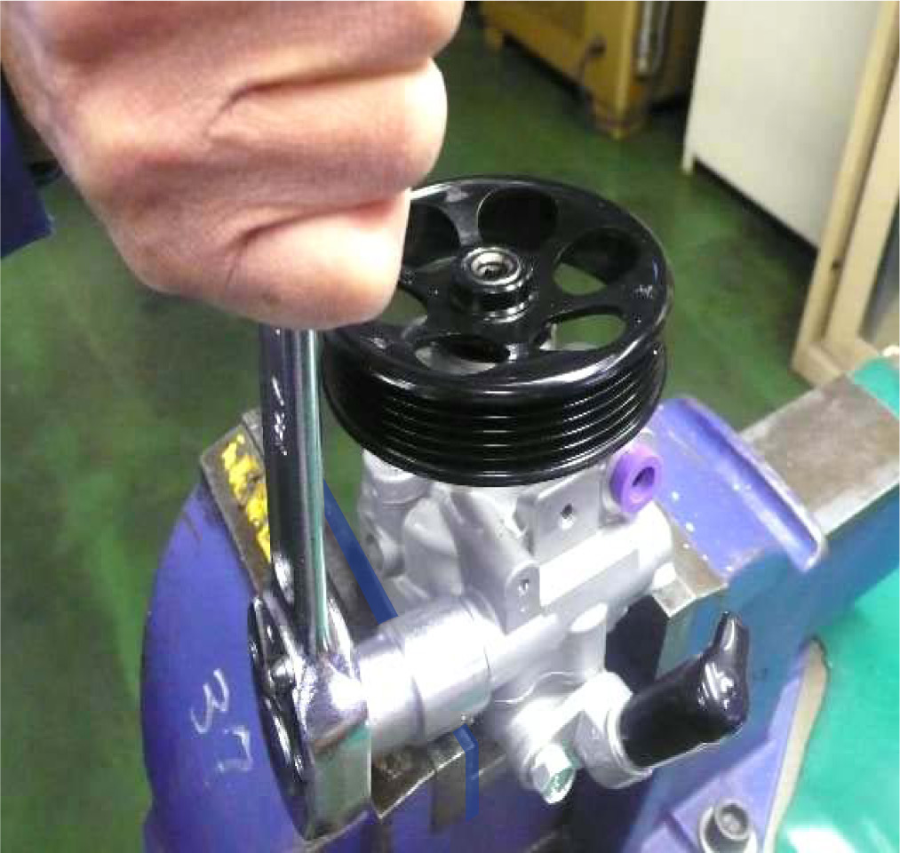 Place the power steering pump in a vise