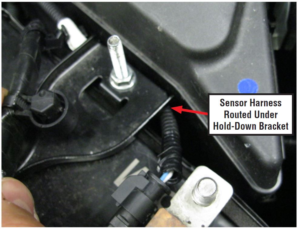 Sensor Harness Routed Under Hold-Down Bracket