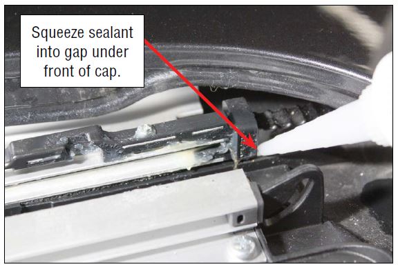 Squeeze sealant into gap under front of cap.