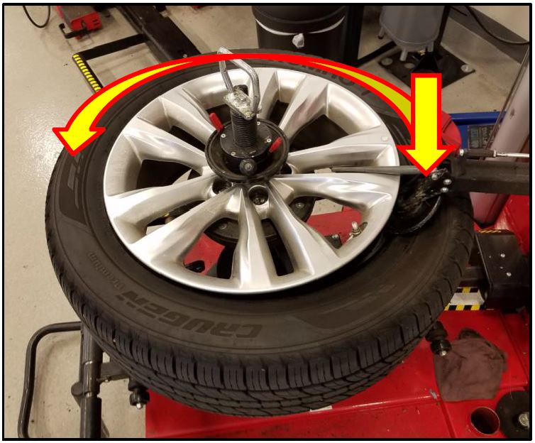 Rotate the wheel/tire assembly counter-clockwise