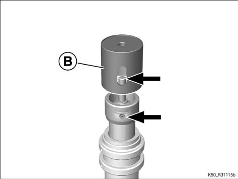Fit the thrust piece (B), aligning the opening to the bleeder screw while doing so (arrows)