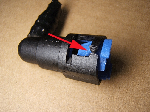 cut the plastic connector on the hose