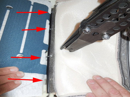 Ensure not to pinch the sensor tail in the process of hog-ringing the trim to the cushion pad