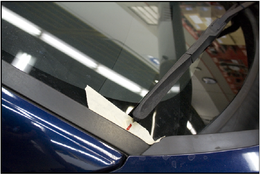 Install the passenger side wiper arm at the marked position