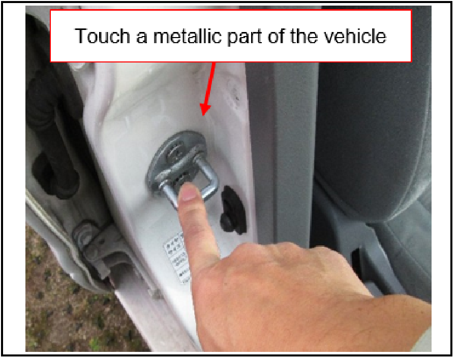 touch a metallic part of the vehicle