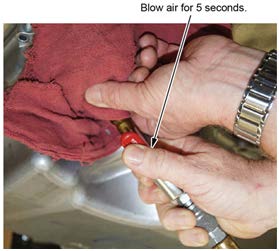 Blow compressed air for 5 seconds through the oil passage