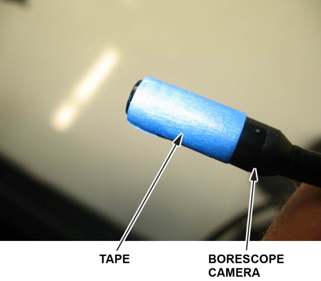 Wrap some masking tape around the front edge of the borescope camera