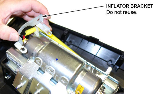 Remove the inflator bracket