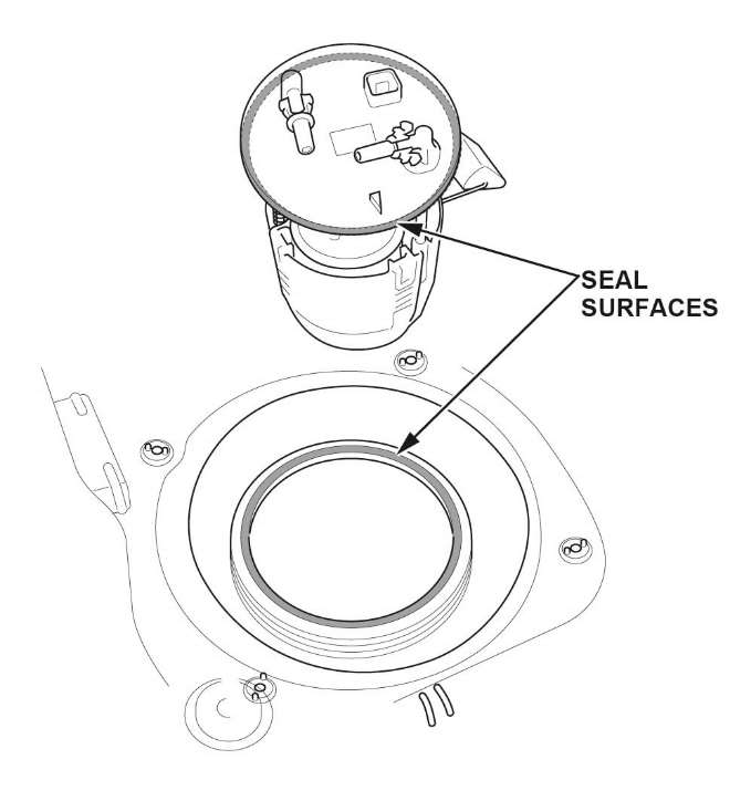 Clean the seal surfaces on the fuel tank unit and gasket groove on the fuel tank