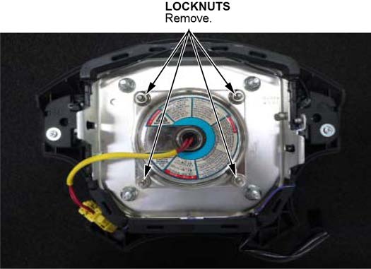 remove the four inflator locknuts and throw them away