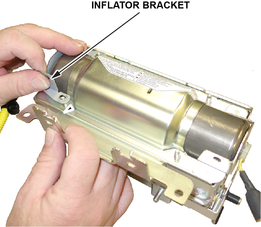 Remove the inflator bracket