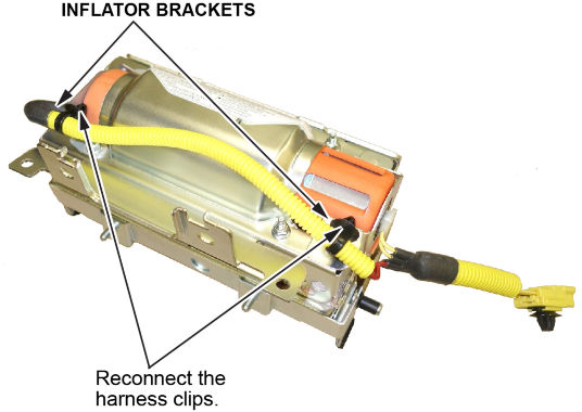 Connect the harness to the inflator brackets