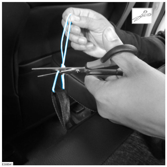 Remove the string attached to the rear seat backrest release strap