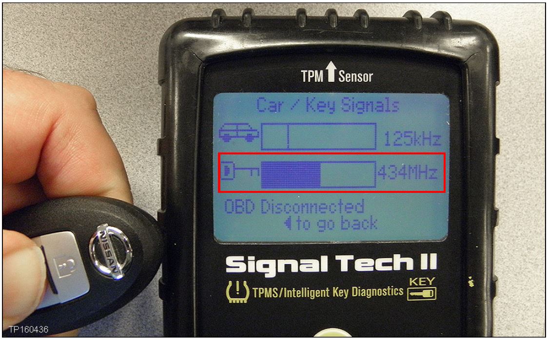 Hold the Intelligent key near the Signal Tech-II and press the Lock or Unlock button
