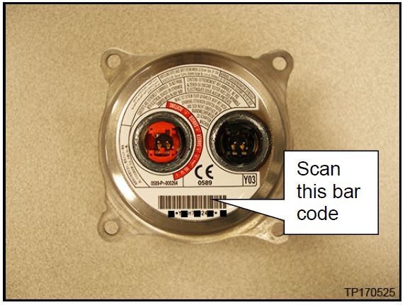 scan the bar code (serial number) on the new inflator