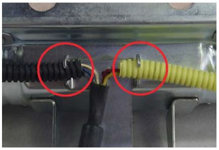 Remove both harness tubes from the retainer bracket
