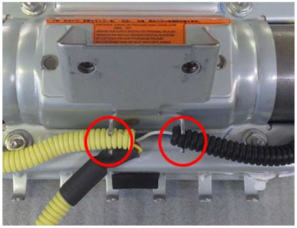 Remove the harness tube from the retainer bracket holders
