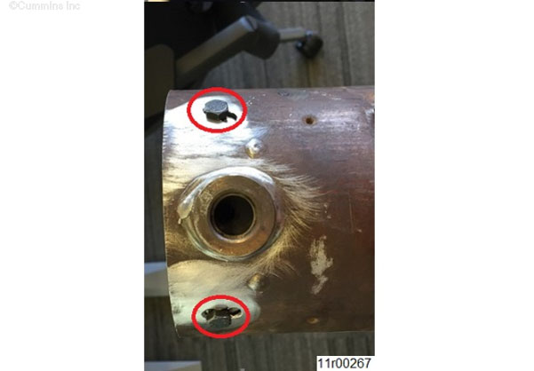 Figure 1, Two Outlet Nox Sensor Bolt-In Water Shield Bolts in the Exhaust Pipe.