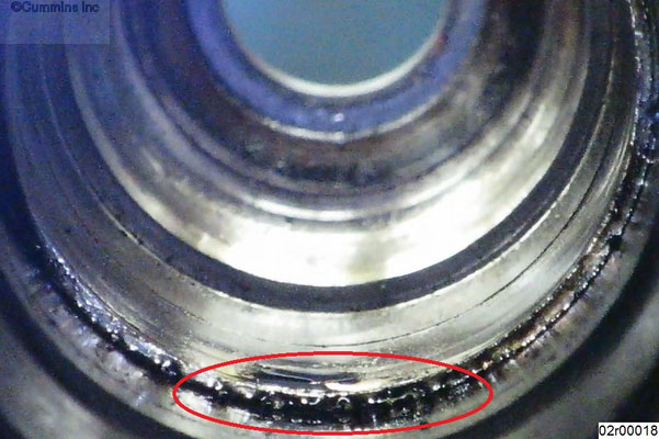 Figure 1, Small Amount of Coolant Leakage Past Injector Sleeve.